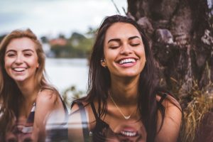 how to be happy - two happy young women